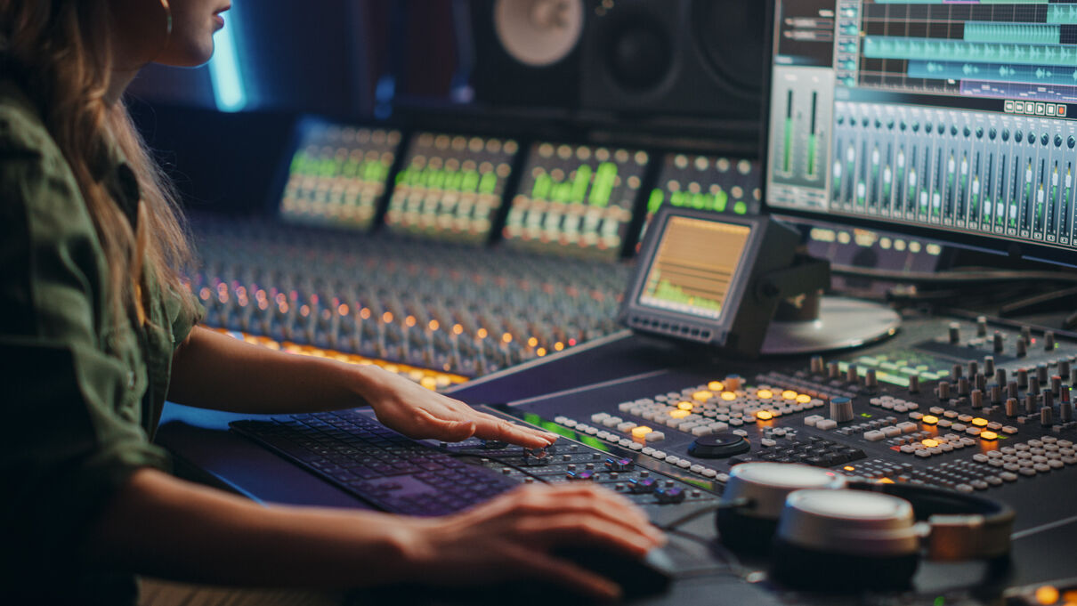 Woman using audio editing equiptment